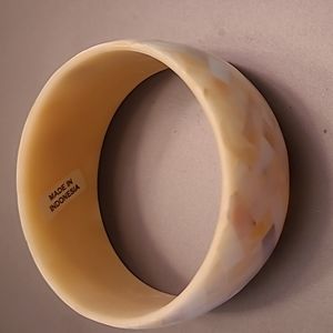 Mother of Pearl Bangle Bracelet 1.25" wide x 2 5/8" across circumference.